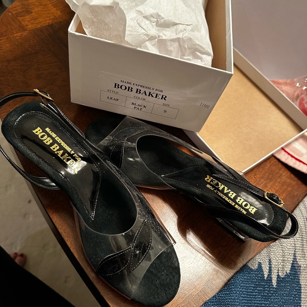 Never been used black & clear low heals sandals day or night they can be used.